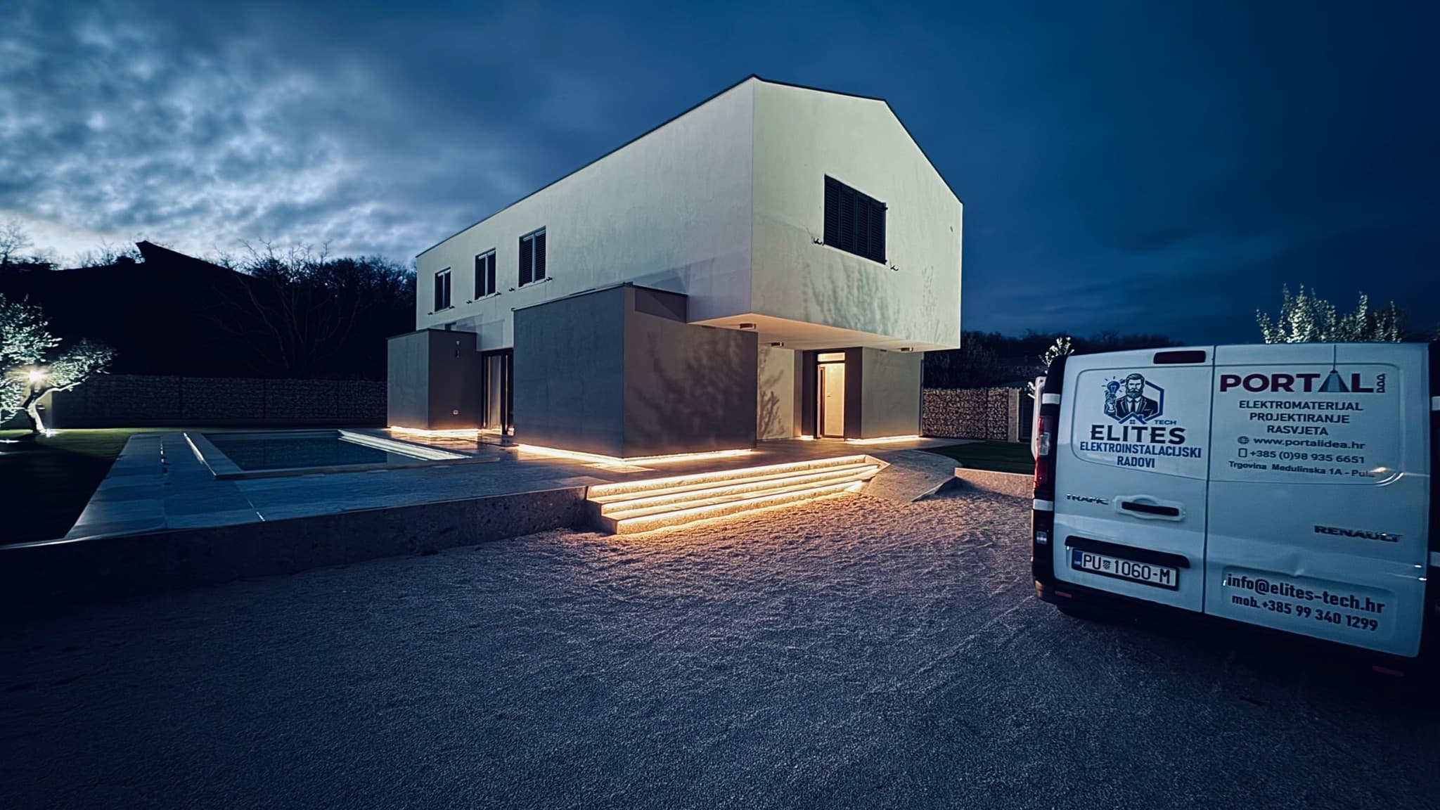 Modern family home with completed exterior LED lighting at dusk.